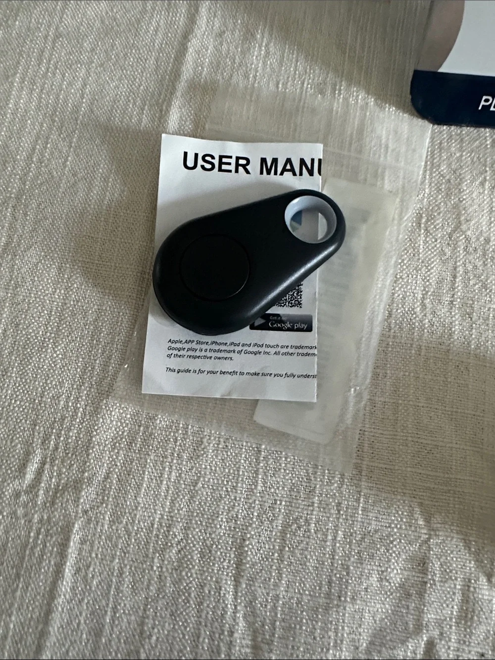 Pink PopSockets for phone, keychain & holder for air tags, a black tracking fob